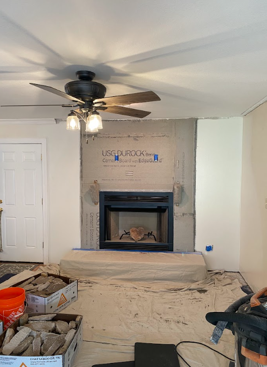 Fireplace area prepared as a clean canvas before installation of a custom stone facade makeover.