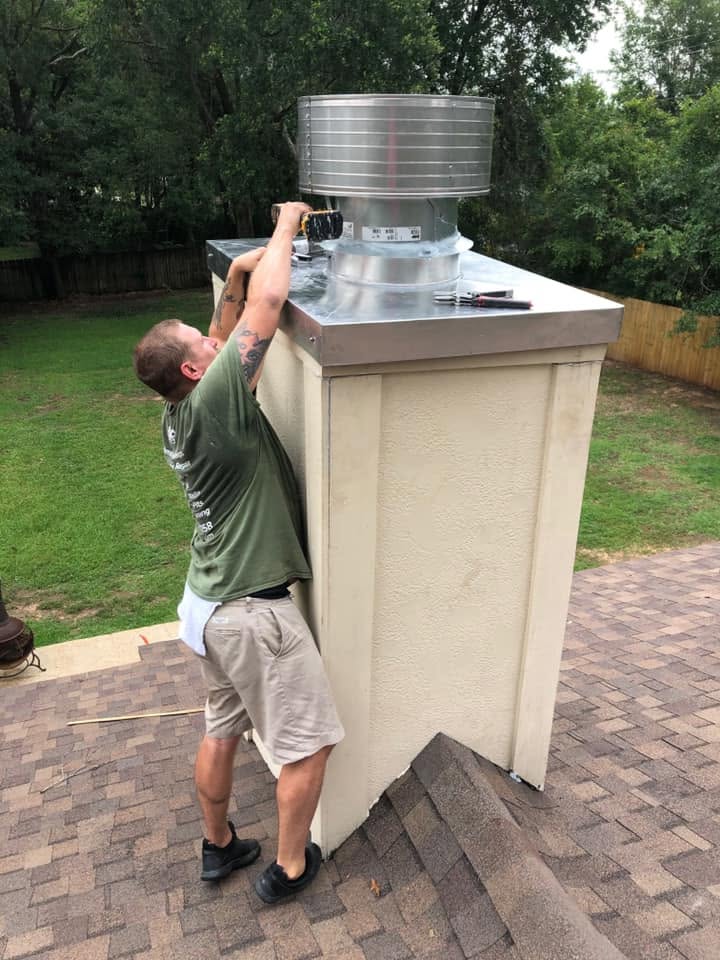 New custom-fabricated chimney chase cover installed to protect the chimney from water damage and improve durability.