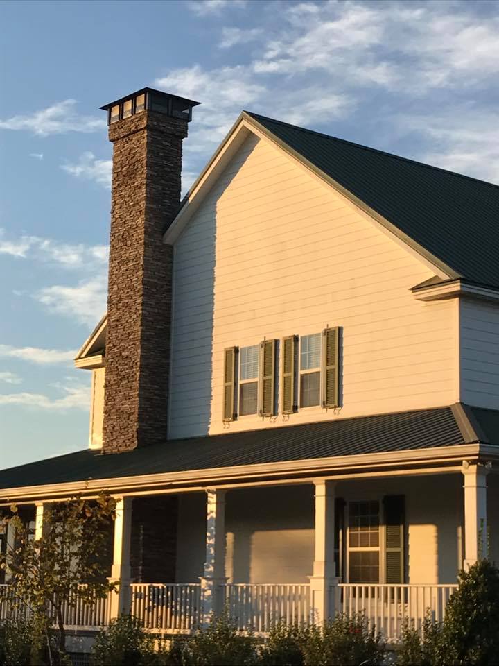 Custom flat-top chimney cap professionally installed to protect the chimney from rain, debris, and animals.