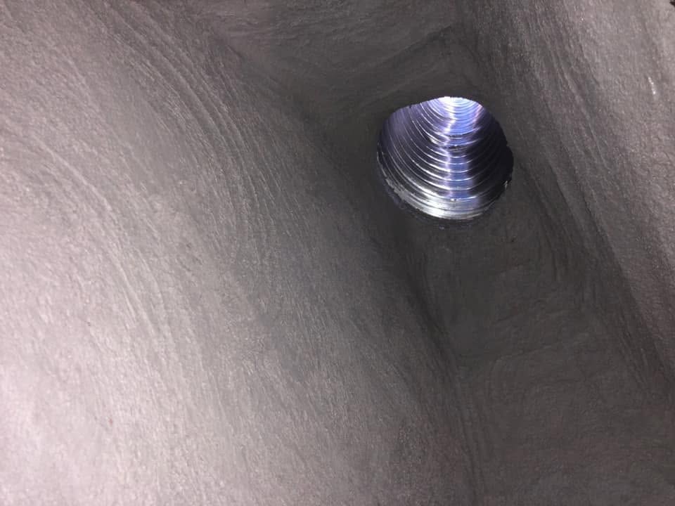 Smoothly resurfaced smoke chamber after professional reline installation to improve safety and performance.