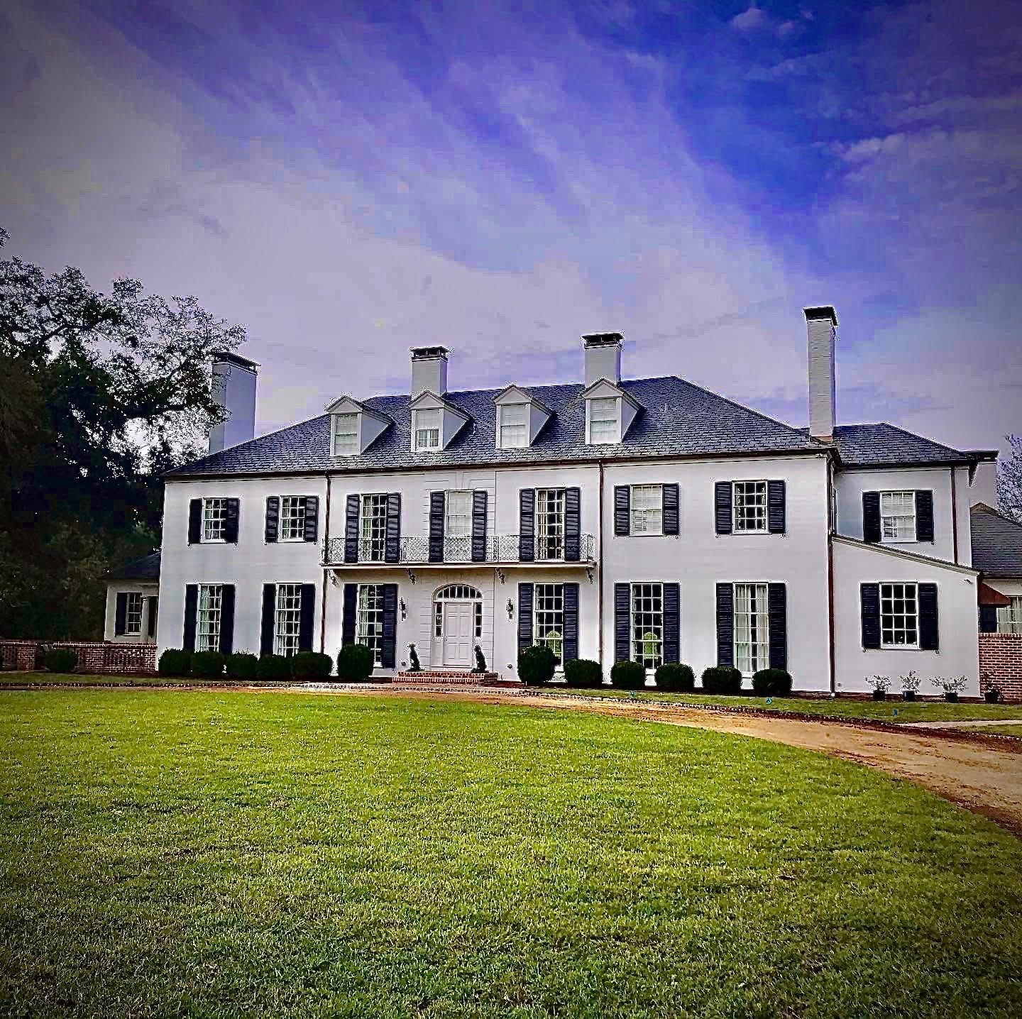 Home featuring four custom chimney caps professionally installed to protect multiple chimney flues.
