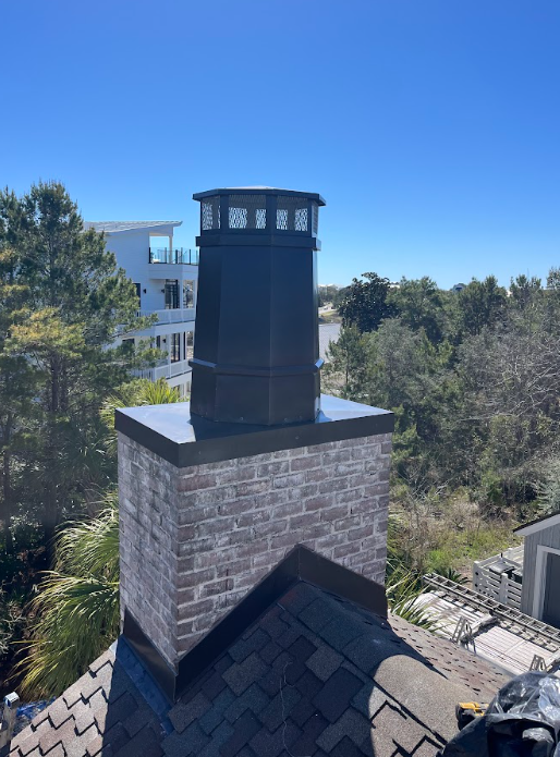 Custom tower chimney cap fabricated and installed to protect the chimney and enhancing the home's architectural style.
